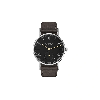 Nomos Ludwig Neomatik mit schwarzem Zifferblatt, weissen r&ouml;mischen Zahlen &  Indizes, goldigen Zeigern. Superluminova-Beschichtung. Kleine Sekunde bei 6 Uhr. Edelstahlgeh&auml;use mit anthrazitfarbenem Veloursleder. Elegant Look.